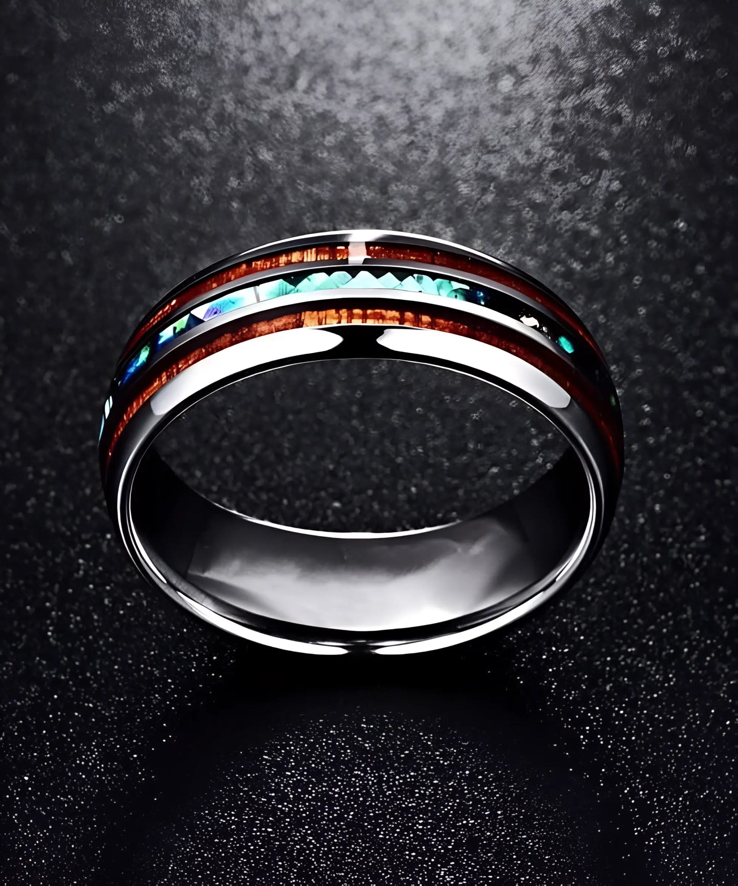 Bague en bois Ark Nat vue du dessus, en tungstène brillant avec incrustations de bois de koa et éclats nacrés bleus et verts